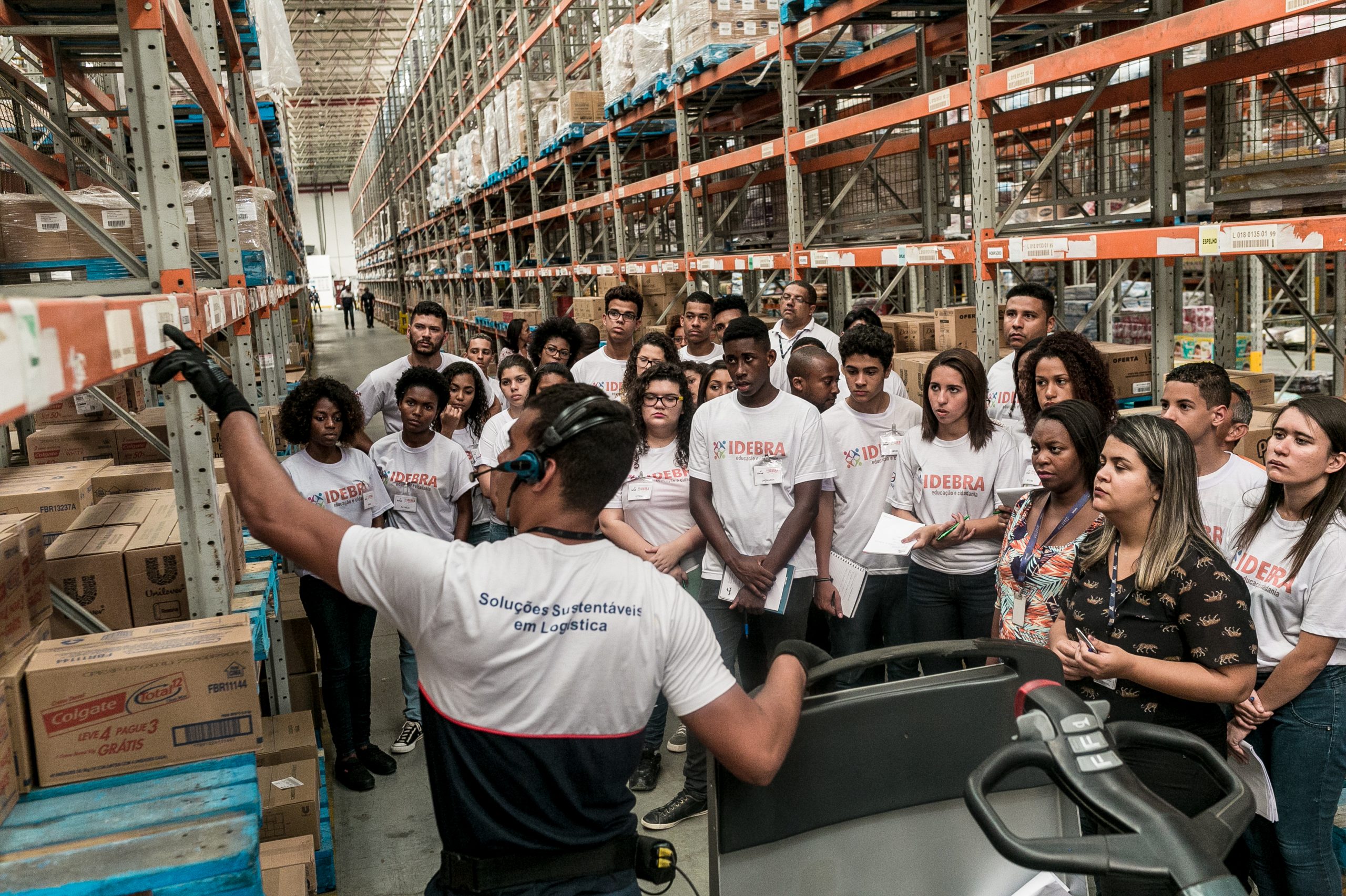 Young IDEBRA students in an ID Logistics warehouse.